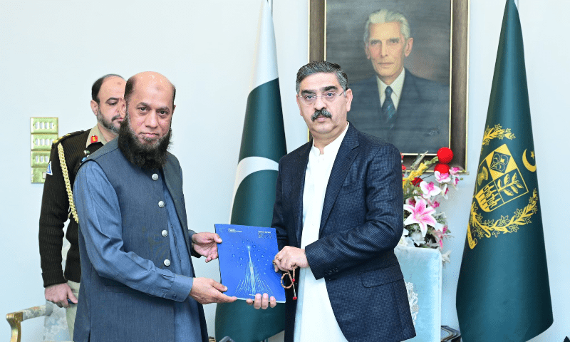PTA chairman retired Major General Hafeezur Rehman presents authority’s 2023 annual report to PM Kakar. X/GovttofPakistan